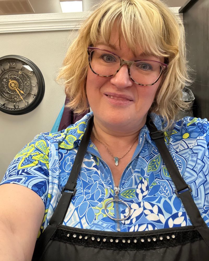 Lisa Warfield in her apron at the salon