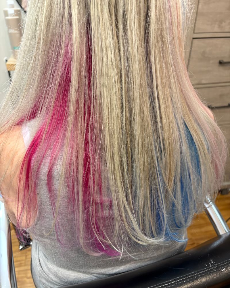 Long blonde hair with vivid pink and blue color